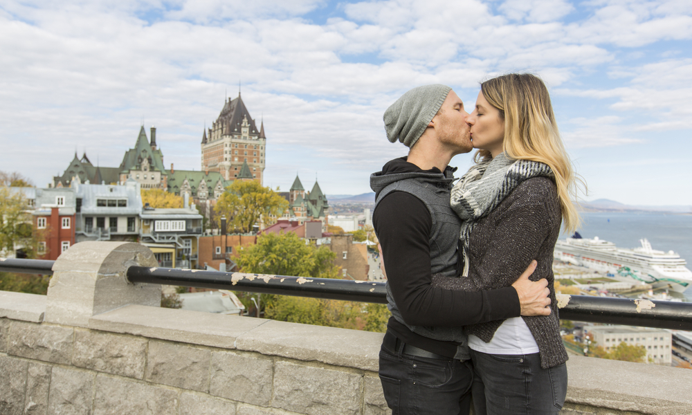 6 Under-the-Radar Romantic Getaways: A Couple in front of Chateau Frontenac at Quebec city Canada