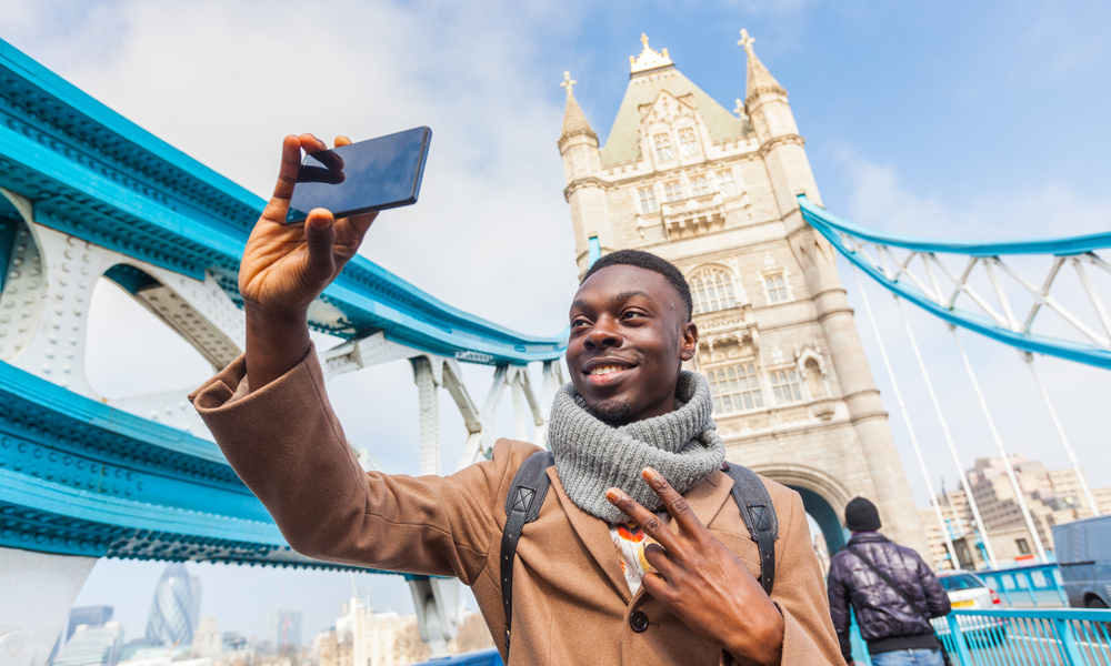 Young man taking selfie in London