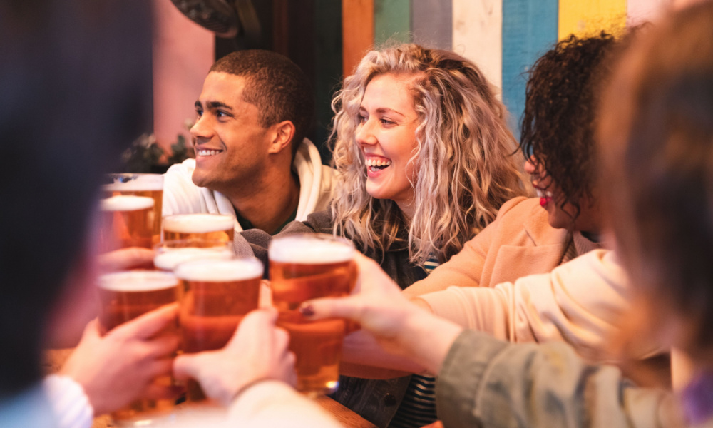 friends toasting at a brewery