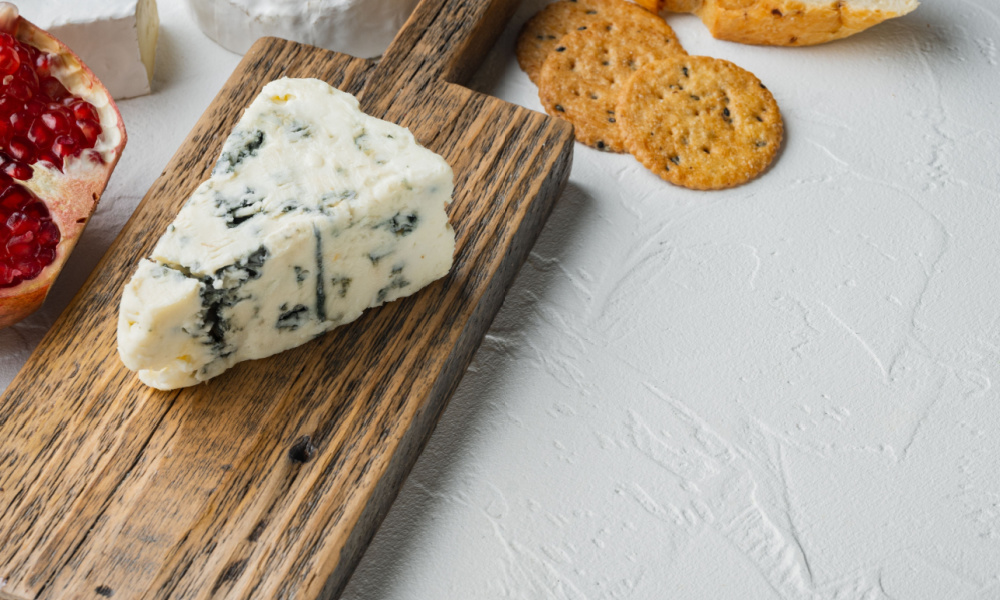 Piece of gorgonzola cheese set, on white background with copy space for text