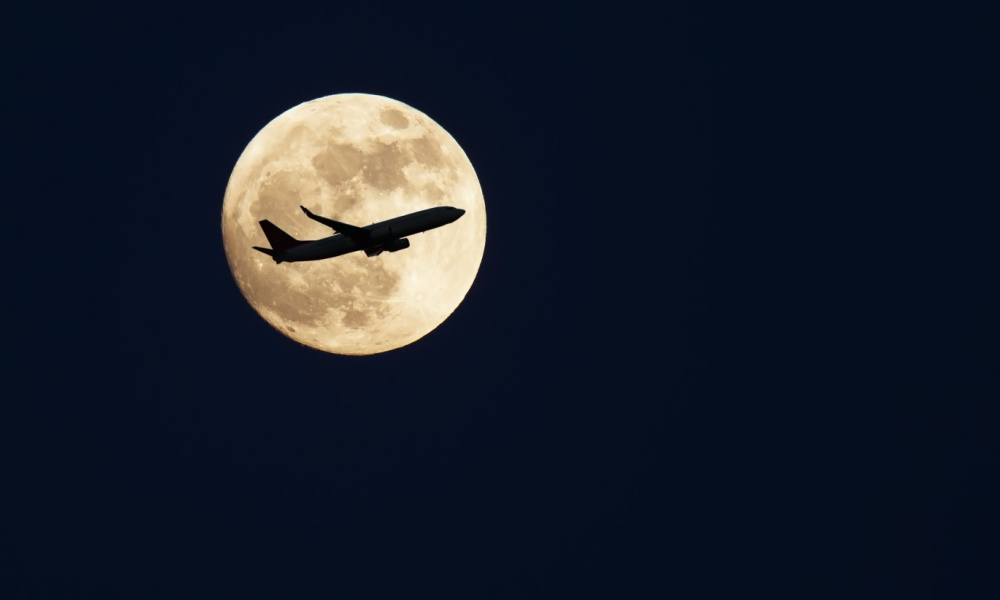 flight over full moon