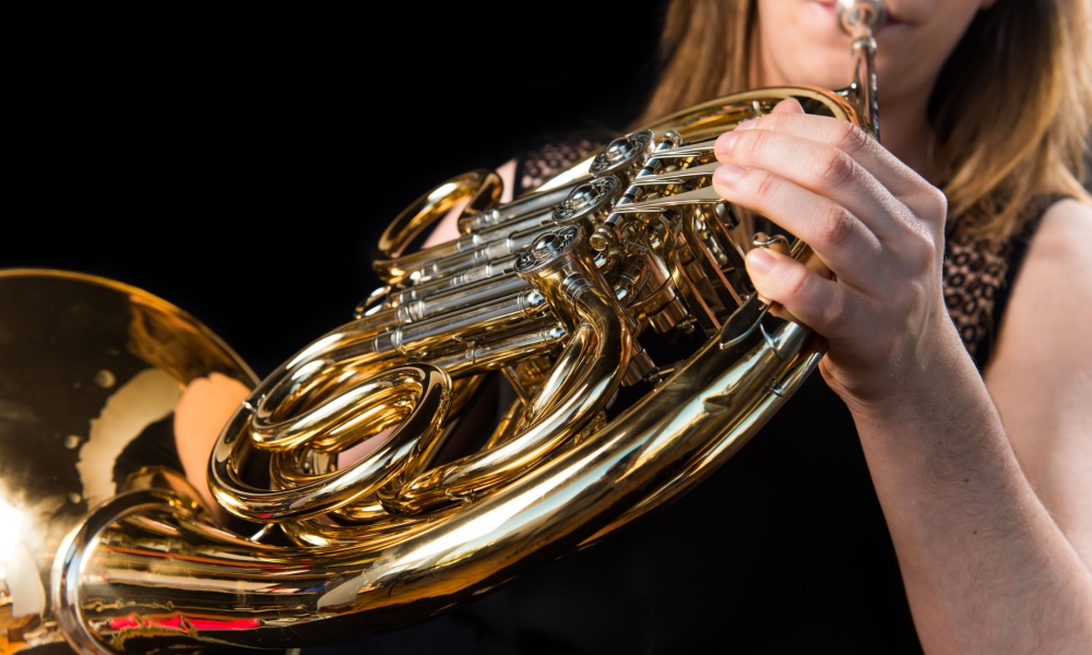 Woman playing the French horn