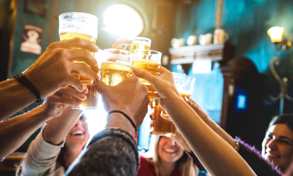 Friends toasting with beer