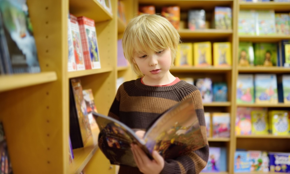 Kid reading comic books