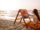 Woman painting on the beach