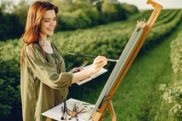 Woman painting outdoors