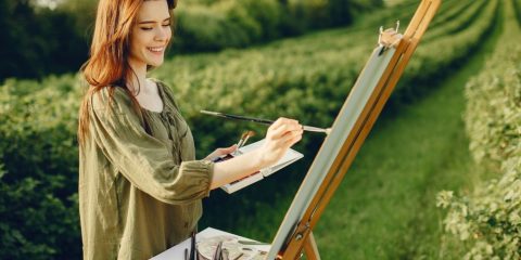 Woman painting outdoors